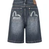 Shorts in denim oversize con tasche stampate a gabbiano