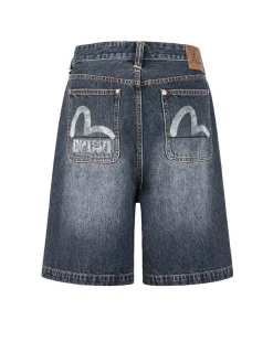 Shorts in denim oversize con tasche stampate a gabbiano