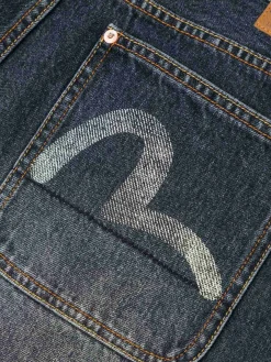 Shorts in denim oversize con tasche stampate a gabbiano